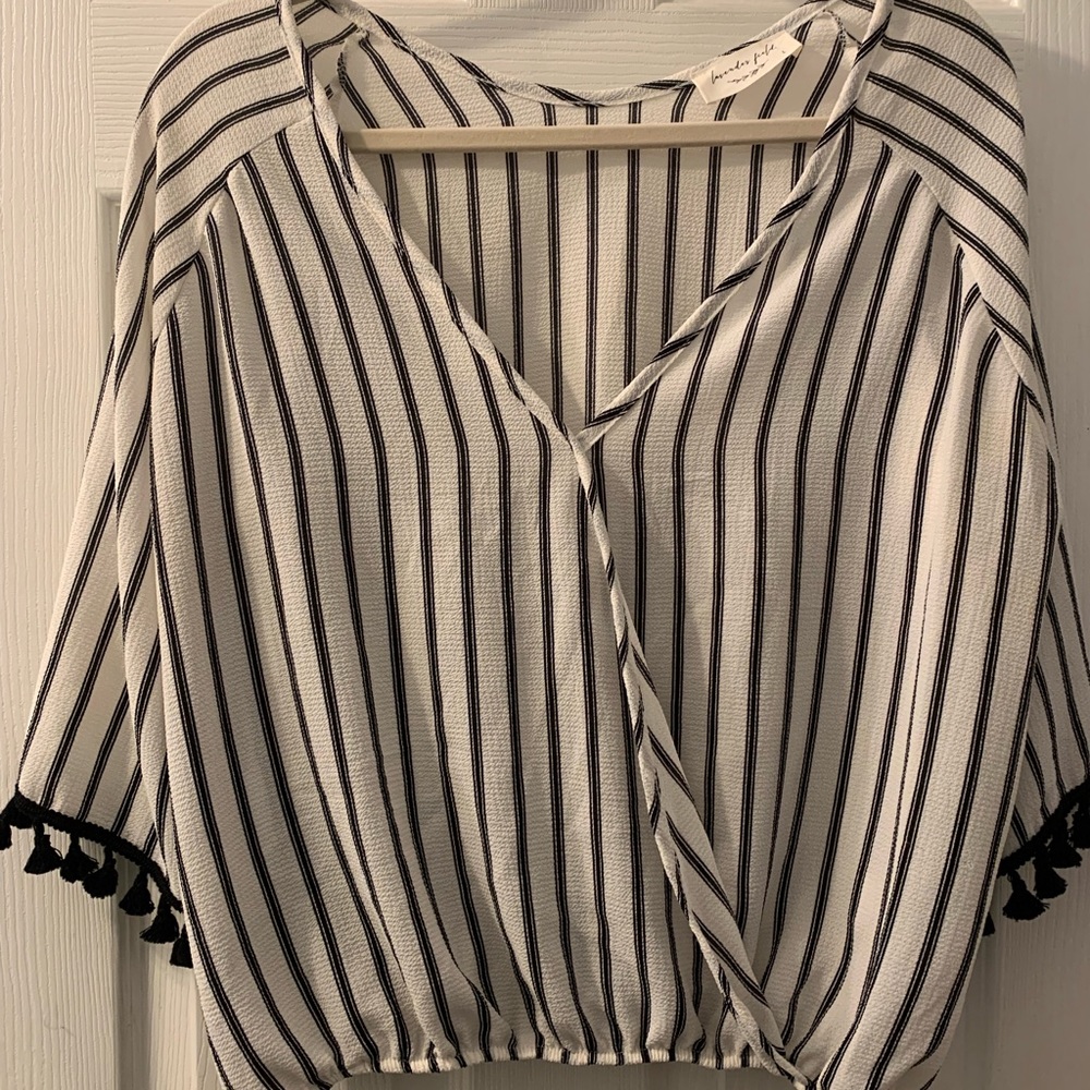 Beautiful drapey finely striped blouse with fun tassel details on sleeves.